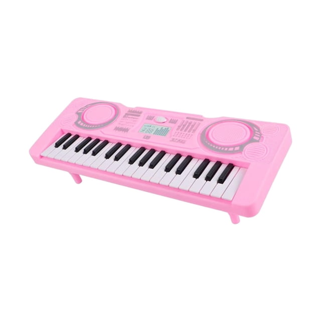 Clavier Piano Électrique 37 Touches Portable Jouet Musical Éducatif Multifonctionnel Rose. un Clavier Électronique Rose avec 37 Touches Noires et Blanches, Haut-Parleurs Doubles, et Commandes Multifonctionnelles. Parfait pour les Enfants, Il Présente une Poignée Portable et un design Ludique, Idéal pour la Pratique de la Musique, le Jeu Éducatif et pour Améliorer les Habiletés de coordination.