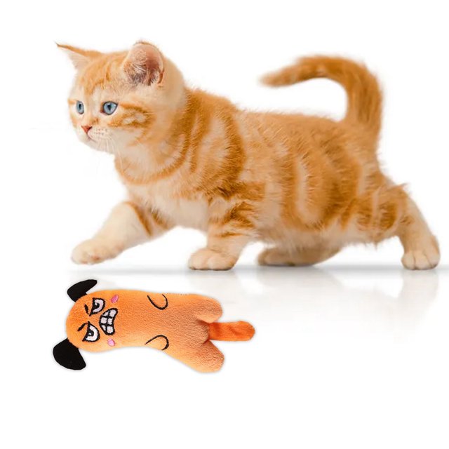 WIFKLSIIPG Since Hi Cat Toy Cute Sound Paper Pet Toy Tail Toy featuring a soft, orange polyester body with a playful cartoon face and black ears. The toy includes a crinkly sound effect to intrigue cats and a soft tail for added interaction. Designed for active play and exercise, it is suitable for both kittens and adult cats. The image shows the toy placed near an orange tabby kitten on a white background.