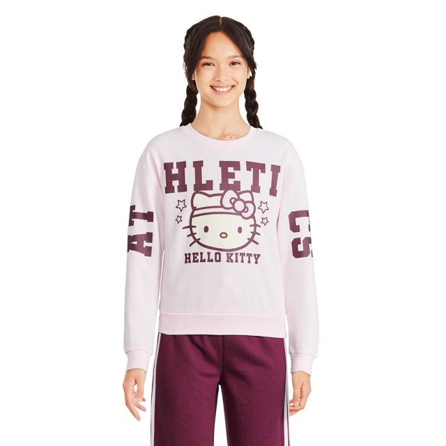 Hello Kitty Girls' Crew Neckline Popover in light pink fleece knit featuring a large Hello Kitty face graphic with stars and maroon text on sleeves, ribbed crew neckline, cuffs, and straight hem, ideal for layering on chilly days and casual wear.