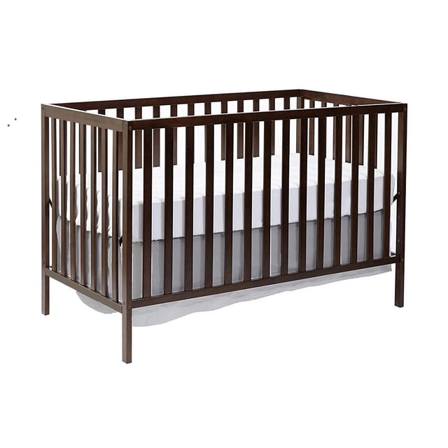Concord Baby Devon 4-in-1 Crib in dark wood with vertical slats and a white mattress set at one of four adjustable heights, featuring a solid wood frame in traditional style, convertible to daybed, toddler bed, and full-sized bed.