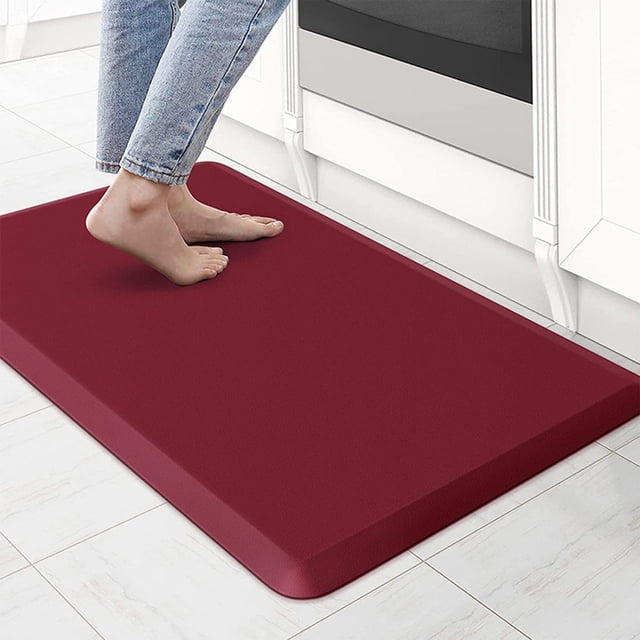 Zanvin Kitchen ToolKitchen Rugs Cushioned Kitchen Mats, Antifatigue Mat for Floor in red color. This nonskid, washable kitchen rug set features a waterproof design and heavy-duty comfort foam construction. The mat measures 44x71cm (17.3x28in) and is ergonomically designed to reduce stress on feet, knees, and joints, making it ideal for standing in kitchens, laundry rooms, or offices. The non-slip backing ensures stability on various surfaces like tile and wood. The stain-resistant surface is easy to clean with a damp cloth or household cleaner.