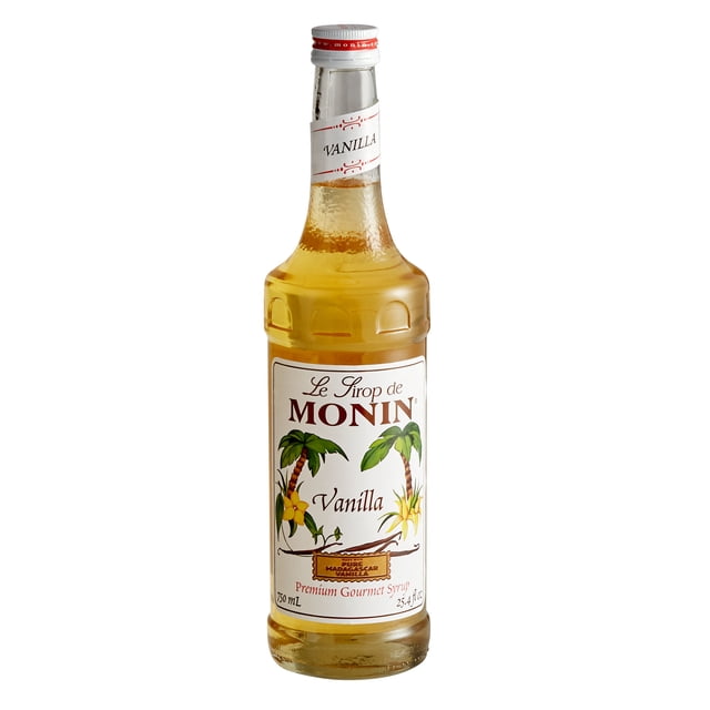 Monin Sirop Aromatisant à la Vanille de Qualité Supérieure de 750 ml dans une Bouteille en Verre Élégante avec une Étiquette Blanche Présentant des illustrations de Palmier tropical et le Texte « le Sirop de Monin Vanille. » Ce Sirop Est Fait avec du Sucre de Canne Pur et Sans Ingrédients Artificiels, Offrant une Saveur de Vanille Douce et Chaude. Idéal pour Rehausser les Cafés, les Lattés et les cocktails Sans Être Trop Sucré. Convient aux Véganes et aux Sans Produits Laitiers, Il Offre 25 (1 oz) Portions par Bouteille et Est compatible avec une Pompe à Sirop Monin