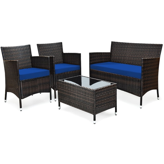 Patiojoy 4-Piece Patio Rattan Wicker Furniture Set Sofa Chair Table Set w/ Navy Cushions. This outdoor set includes two single chairs, one loveseat, and one coffee table, all made with a sturdy steel frame and weather-resistant hand-woven rattan. The navy cushions add a bold touch to the design, while the tempered glass tabletop offers a sleek surface for drinks or snacks. Perfect for patios, balconies, gardens, or poolside areas.