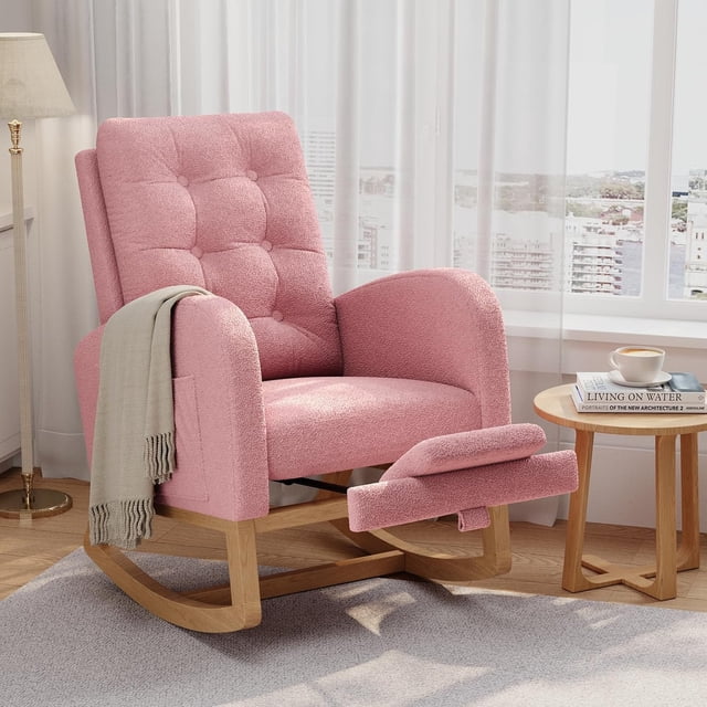 Twister.CK Modern Rocking Accent Chair with Footrest in pink, featuring a tufted upholstered design with soft-touch fabric. The chair includes a contoured backrest, rounded armrests, and a padded seat for ergonomic comfort. It has a durable hardwood frame with a smooth rocking motion and non-slip base pads. A built-in side pocket adds convenience, making it ideal for nurseries, living rooms, or bedrooms. Shown in a bright room with a side table and a cup of coffee.