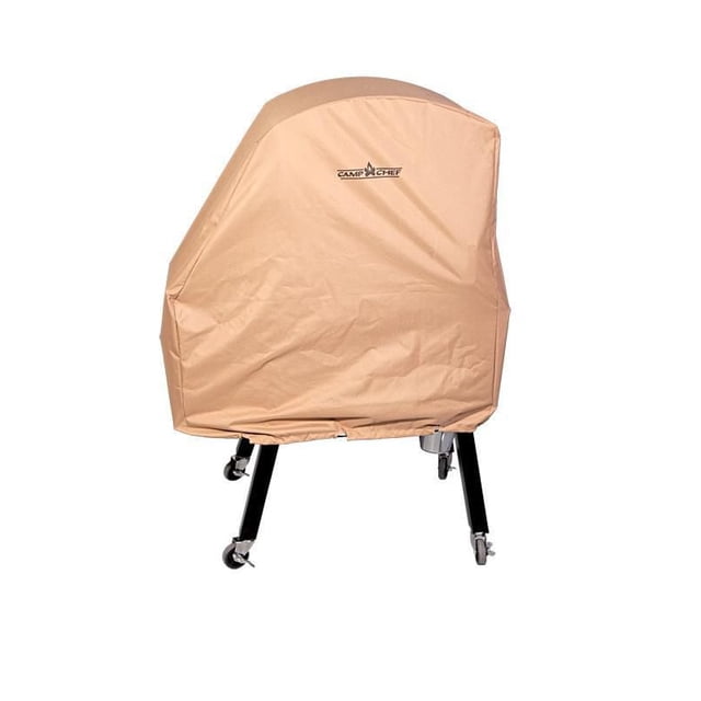 CAMP CHEF XXL PELLET SMOKER COVER in tan, made of durable 600 Denier-coated nylon with a weather-resistant liner and sewn-in bungee cord, fitted over a pellet smoker with black metal legs and caster wheels to protect outdoor BBQ equipment from weather.