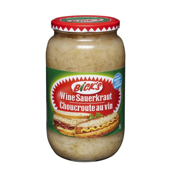 Bick's Wine Sauerkraut in a clear 1L glass jar with a red lid, filled with finely shredded pale cabbage. The green label features the Bick's logo and images of a sandwich and hot dog topped with sauerkraut, highlighting its traditional German food flavor and use as a crunchy topping for BBQ dishes.