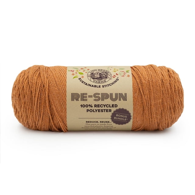 Lion Brand Re-Spun Bonus Bundle Yarn in heliotrope, a 284-gram skein of 100% recycled polyester worsted weight yarn in warm orange, machine washable and dryable, wrapped with a beige label featuring the Lion Brand logo and sustainable stitching text, suitable for eco-friendly knitting, crochet, and home décor projects.