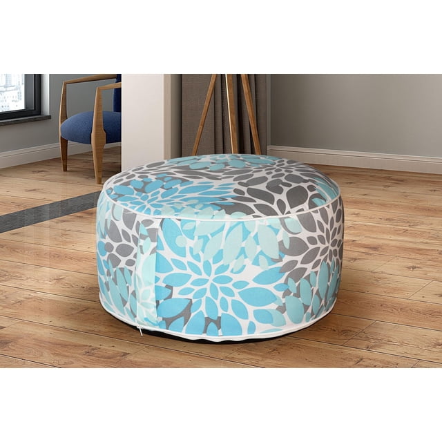 VIOLA Inflatable Ottoman - Blue Leaf round inflatable stool with blue and gray quatrefoil lattice floral pattern, string handle for portability, placed on hardwood floor near blue armchair and wooden tripod lamp, ideal as footstool or extra seat for home or travel.