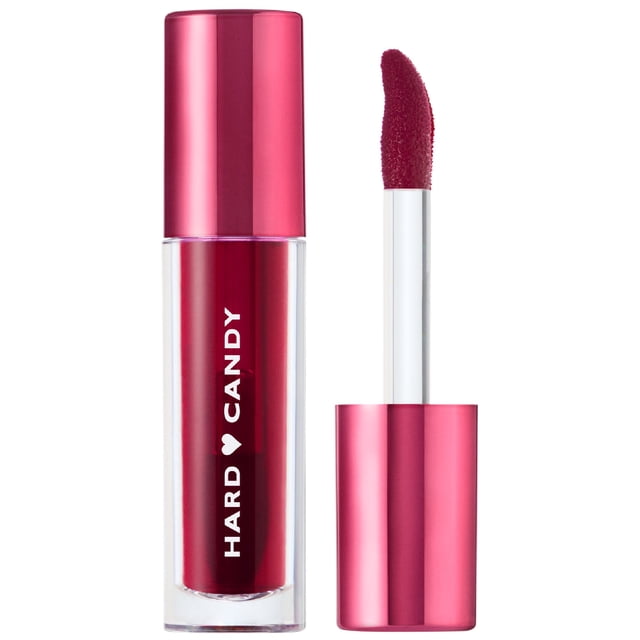 Pop Tint Lip Stain Watermelon Crush by Hard Candy with a clear tube of sheer red tint and metallic pink cap. The applicator wand with a curved, fuzzy tip coated in tint is shown beside the tube, suitable for lips and cheeks.