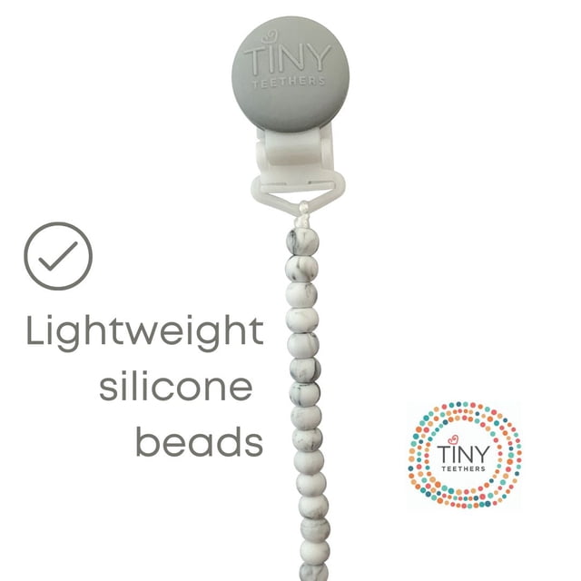 Tiny Teethers Clip-On Silicone Pacifier Clip 4.5-inch (11.4 cm) strand with 100% food-grade silicone beads and metal-free plastic clip. Lightweight design stays clipped to clothing; soft chewable beads for teething; cleans with warm soapy water.
