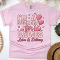 thumbnail image 1 of Women’s Graphic Tee with Heart Lollipop Design for Maternity Nurses, Light Pink, Size L, 1 of 6