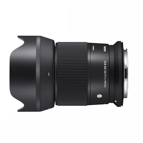 Sigma 23mm F1.4 DC DN RF Mount camera lens shown in a side profile view, featuring a compact, lightweight design with a matte black finish. The lens includes a wide-angle 23mm focal length and a bright f/1.4 aperture, ideal for low-light photography and creating bokeh effects. Optimized for RF mount cameras, it is suitable for street, portrait, and travel photography.