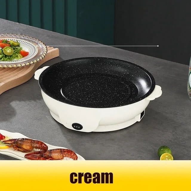 KEINXS 220V Multifunction Non-Stick Electric Frying Pan in a cream finish, featuring a round non-stick skillet with a speckled black interior. The pan offers precise temperature control with an easy-to-use button, adjustable from 600W for searing to 300W for slow cooking. Designed for versatile cooking, it allows frying, grilling, baking, roasting, and barbecuing. The anti-scald handle ensures safe handling, and the non-stick surface simplifies cleanup. Shown on a kitchen countertop with food items nearby.