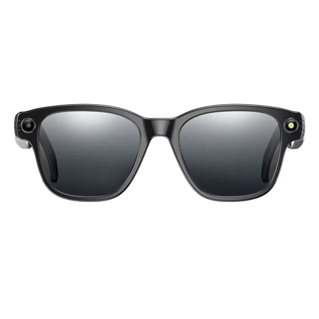 TUTT GS10 AI Glasses with a sleek black frame and adaptive photochromic lenses that automatically adjust to light conditions. Includes an HD camera on the left temple and an AI sensor on the right temple for intelligent object recognition, real-time translation, and AI voice assistance. Replaceable with prescription lenses and compatible with major AI platforms, these smart sunglasses are perfect for dynamic environments.