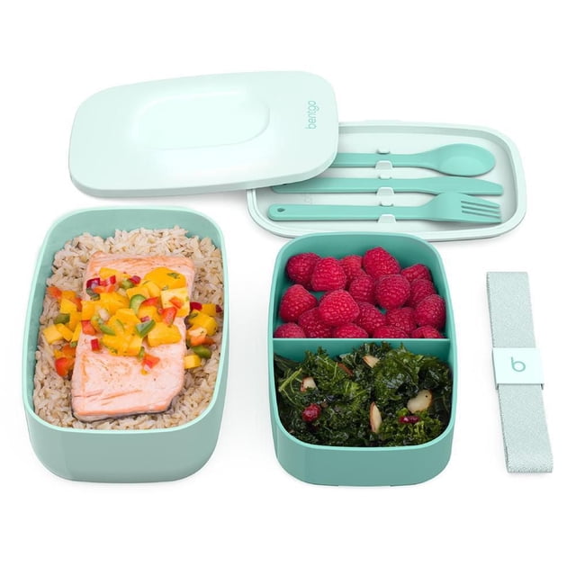 Bentgo Classic Lunch Box in coastal aqua with two stackable containers; one holds brown rice topped with cooked salmon and mango salsa, the other divided into sections with fresh raspberries and kale salad. Includes built-in utensil set and secure strap for easy portability.
