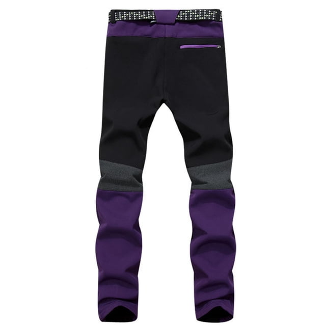 Women Insulated Snow Overalls Solid Color Pocket Trousers Pants in a black and purple color combination. These insulated snowpants feature a long length, zippered pocket, and a studded belt for added detail. Made from polyester, they are designed for casual daily wear or outdoor activities in cold weather.