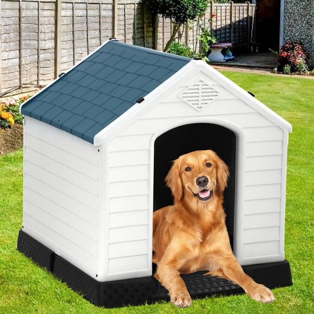 32-inch dog house by NiamVelo, designed for small, medium, and large dogs. The house features a durable plastic construction in blue and white, with a slanted roof and ventilation vents for air circulation. It includes a raised base for weatherproofing and insulation, making it suitable for all seasons. The image shows the dog house placed outdoors on a lawn, with a golden retriever resting at the entrance.