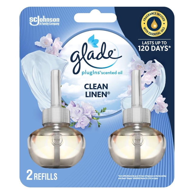 Glade Plugins® Recharge d'Huile pour Assainisseur d'Air Linge Propre avec Deux Bouteilles de Recharge d'Huile Rondes Transparentes avec Capuchons Blancs sur Emballage Bleu Décoré d'Images Florales et de Lin, Infusé d'Huiles Essentielles et Durée jusqu'à 120 Jours