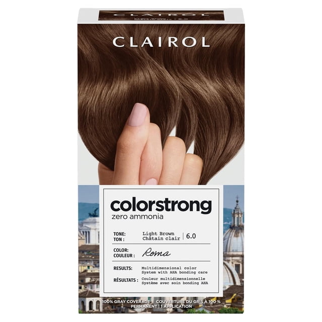 ColorStrong Permanent Hair Dye by Clairol in light brown 6.0 tone with zero ammonia, featuring multidimensional color and AHA bonding system to reinforce hair structure, shown on a box with a hand holding light brown hair strands and a background of Rome cityscape.