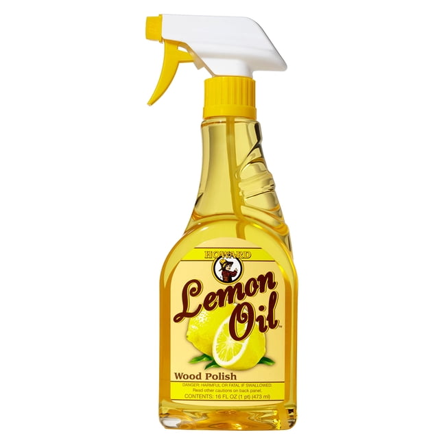 Howard LM0016 Lemon Oil Wood Polish in a 16-ounce spray bottle. The bottle features a clear yellow liquid with a white and yellow spray nozzle. The label displays the Howard Products logo, the product name, and an image of fresh lemons, emphasizing its lemon oil formula for polishing and conditioning wood surfaces.