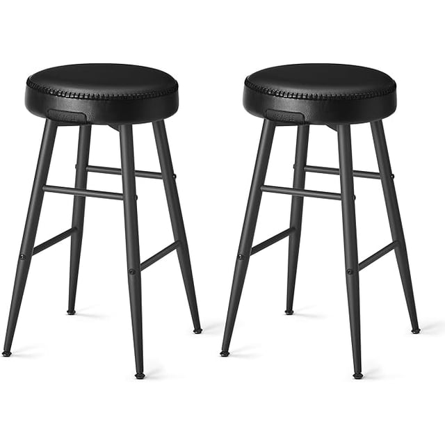 VASAGLE Echo Collection Bar Stools Set of 2 in ink black, designed for kitchen counters. These stools feature synthetic leather seats with refined stitching, tapered steel legs, and staggered footrests for comfort and versatility. Each stool measures 19.5 inches deep, 19.5 inches wide, and 24.8 inches high, with a maximum load capacity of 265 lbs. High-resilience foam provides lasting comfort, while swivel leveling feet ensure stability on uneven surfaces.