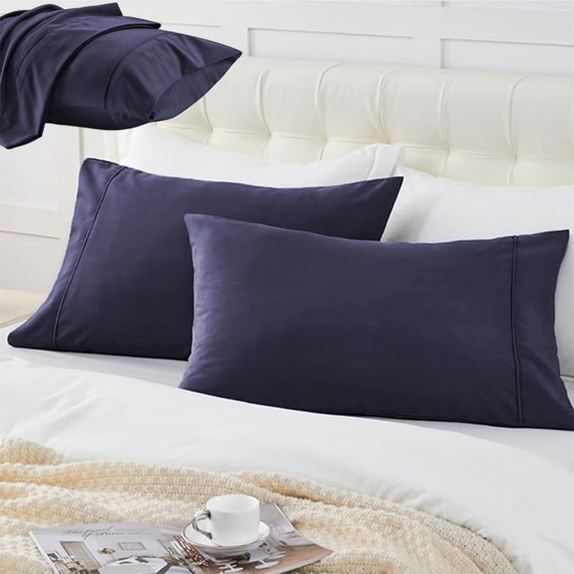 Czzoypi Pillowcases (Purple), medium cool pillow covers made of soft brushed polyester fabric with an envelope-style closure. The set includes one breathable and comfortable pillowcase, measuring 25.9x20 inches (66x51 cm). The deep purple color adds elegance to the bedding, shown on a white bed with a tufted headboard. Suitable for sound sleepers, the pillowcase is machine washable and ideal for year-round use.