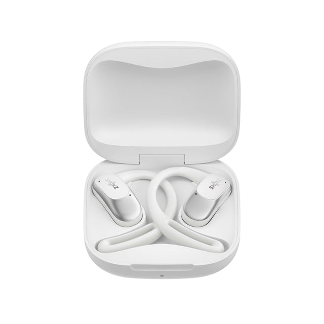 Shokz OpenFit Air true wireless open-ear earbuds in white inside an open white charging case, featuring ergonomic earhooks, Bluetooth 5.2 with multipoint pairing, and visible Shokz branding, designed for comfort and situational awareness during active use.