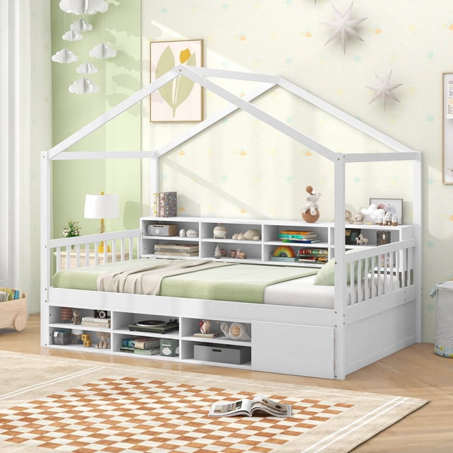 Costway Lit Cabane Format Simple Cadre de Lit Plateforme en Bois avec Toit et 14 Cubes de Rangement en Blanc. le Lit Présente un Cadre en Forme de Maison avec Clôture Protectrice, un design de Plateforme pour la Stabilité du Matelas et une construction en Bois Robuste Pouvant Supporter jusqu'à 440 Lb. Il Comprend 8 Cubes de Rangement de Chevet, 6 Cubes de Rangement sous le Lit et une Armoire Fermée pour Organiser des Livres, des Jouets et des Vêtements. le Lit Est Présenté dans une Chambre d'Enfant avec des Murs Vert Pâle, des Étoiles Décoratives et un Tapis à Carreaux.