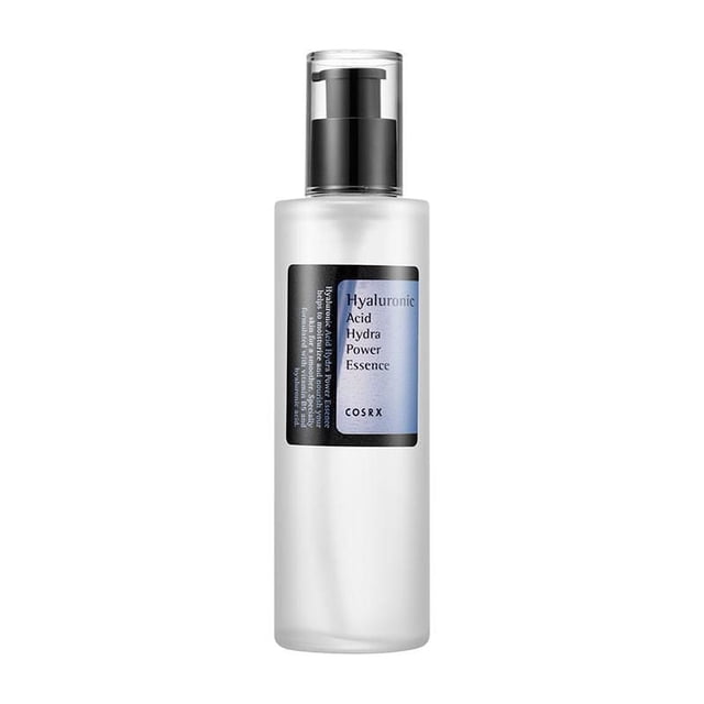 COSRX Hyaluronic Acid Hydra Power Essence in a frosted 100ml bottle with black pump dispenser and clear cap, featuring a blue and black label, a facial serum for skin hydration and moisture retention suitable for daily use.