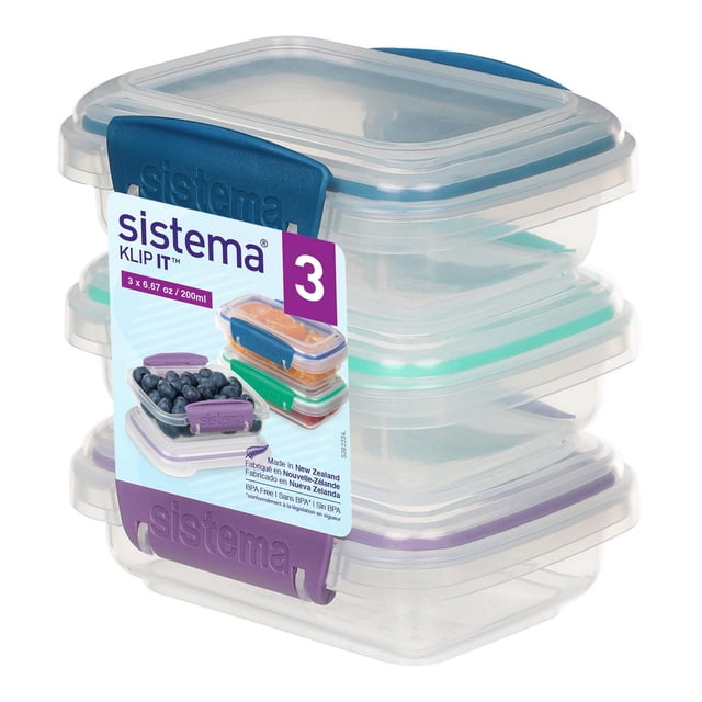 Set of three clear Sistema Klip It food storage containers with colored clips in blue, green, and purple for airtight sealing.