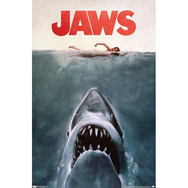 Jaws - One Sheet Wall Poster, 22.375" x 34" showing a front-facing great white shark underwater with an open mouth and sharp teeth, swimming toward a woman on the water surface above. The poster features a large red JAWS title on a light background and is printed on glossy paper ideal for home décor and wall art.