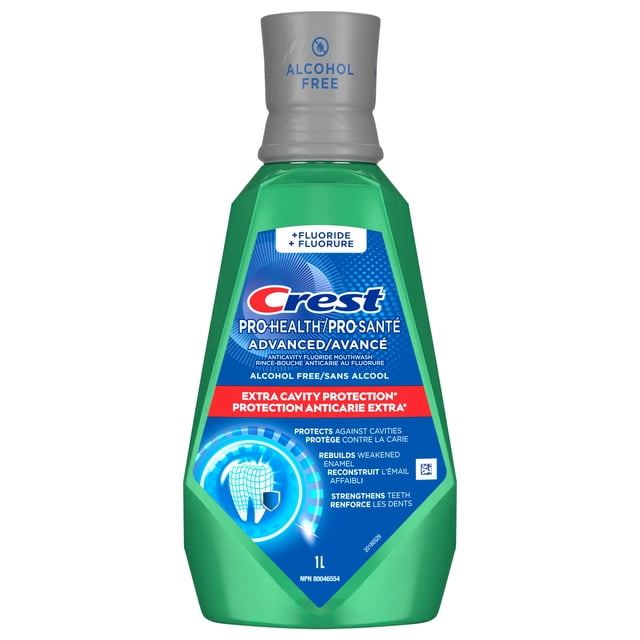 Crest Pro-Health Advanced Maximum Cavity Protection Mouthwash in a green 1L bottle with a gray alcohol-free cap, featuring fluoride to protect against cavities, rebuild weakened enamel, and strengthen teeth, with bilingual English and French text on the label.