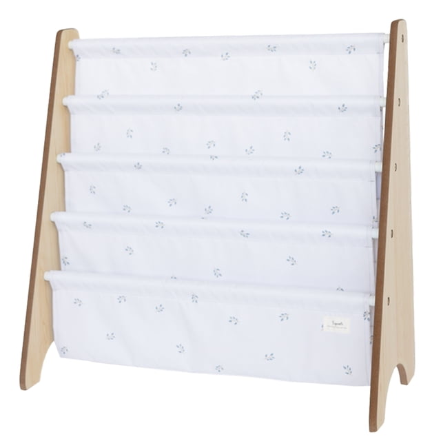 3 Sprouts ivory blueberry recycled fabric book rack featuring a wooden frame with four front-facing fabric pockets made of 100% recycled polyester. This book storage solution measures 24 inches in height, 24.5 inches in width, and 10 inches in depth, ideal for toddlers to access books easily. The fabric displays a subtle blueberry pattern on an ivory background.