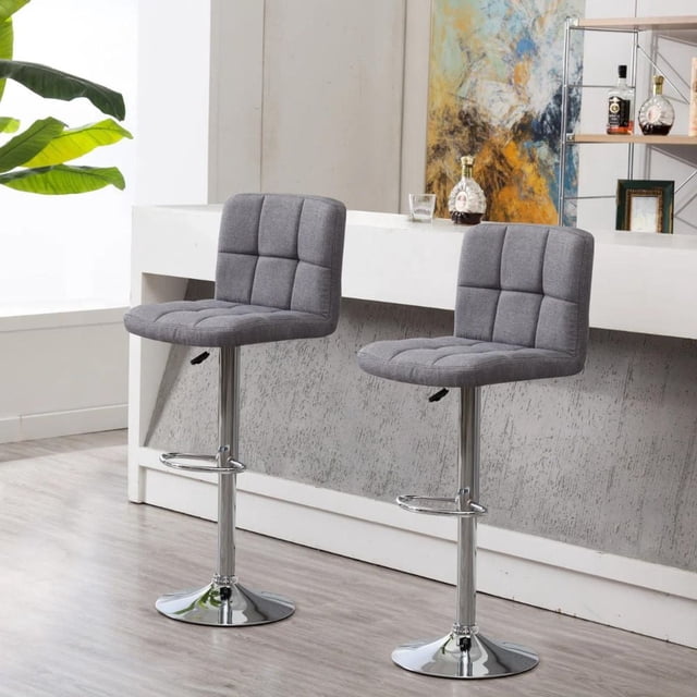 Heavenly Collection Paul Adjustable Stool set of 2 with gray square tufted upholstered seats and backs, chrome pedestal bases with footrests, adjustable height and 360° swivel, suitable for kitchen islands or home bars in modern interiors.