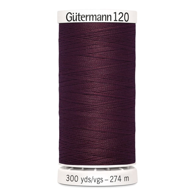 Gutermann 120 100% polyester all purpose thread spool in dark purple on a white plastic base labeled 300 yards (274 meters), suitable for machine and hand sewing all fabric types including cotton, synthetics, and wool, also ideal for craft and DIY projects.