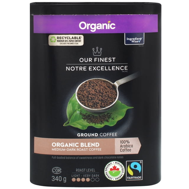 Our Finest Organic Blend Ground Coffee in a black resealable container with a purple Organic label, featuring 340g medium-dark roast 100% Arabica coffee, Fairtrade and Canada Organic certified, with a scoop of ground coffee on green leaves.