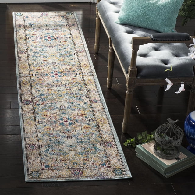 Safavieh Aria Cromwell Traditional Area Rug runner with a distressed Persian floral and medallion pattern in muted blues, yellows, and reds on a light background, power-loomed from synthetic yarns for durability, placed on dark hardwood floor beside a grey tufted bench with a teal cushion, ideal for high-traffic home areas.
