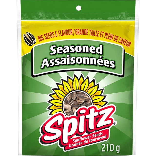 Spitz Seasoned Sunflower Seeds 210 g bag with green and yellow packaging featuring a sunflower graphic and bold red Spitz logo, emphasizing big roasted seeds and savoury flavour for a crunchy snack.