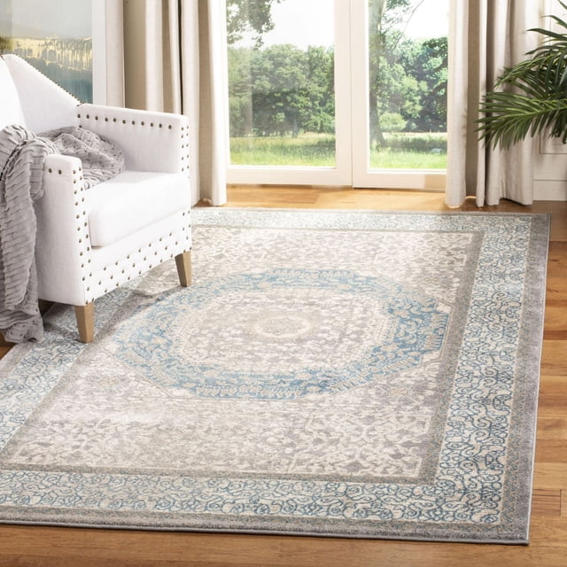 Safavieh Sofia Waylon Geometric Bordered Area Rug on hardwood floor in a bright room, featuring a traditional geometric medallion pattern with distressed grey and blue tones, ideal for accenting living spaces and adding warmth.