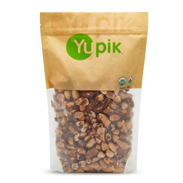 Yupik Organic Dry Roasted Brazil Nuts, 1Kg, packaged in a resealable kraft paper bag with a transparent lower section displaying the golden-brown, half-moon-shaped nuts. The bag features the Yupik logo in green and certifications for organic and kosher. Ideal for snacking or as a topping for ice cream and desserts.