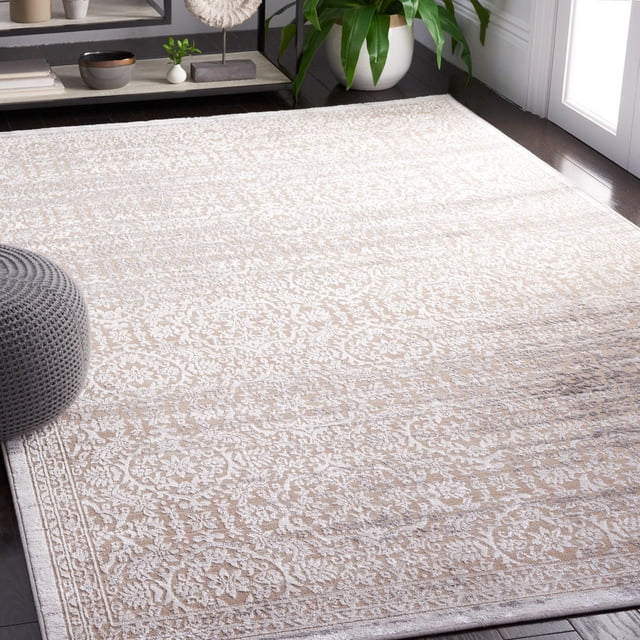 SAFAVIEH Amelia Velda Abstract durable area rug in beige with a white textured floral and vine pattern, shown on dark hardwood floors in a bright room with a gray knitted pouf and a white planter with green leaves by a window, ideal for accenting living rooms or bedrooms.