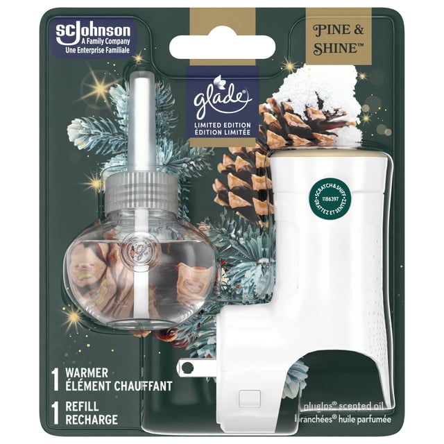Glade Plugins® Air Freshener Oil Refill Pine & Shine™ limited edition pack with clear oil refill and white plug-in warmer, featuring pine cones and frosted pine branches on packaging, designed to provide continuous festive home fragrance with balsam fir, cinnamon, and clementine notes.