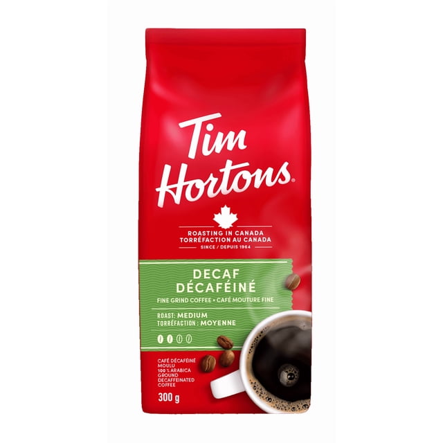 Tim Hortons Decaf Ground Coffee, Medium Roast, Ground Coffee Bag, Made with 100% Arabica Beans, Smooth & Balanced, Rich Taste, 300g — sealed 300 g retail bag of medium-roast decaf ground coffee made with 100% Arabica beans, roasted in Canada since 1964; labeled for pour over, French press or drip brewing; suitable for evening or low-caffeine home servings.