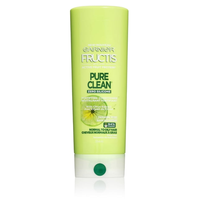 Garnier Fructis Pure Clean Conditioner in a 354 ml light green bottle with white flip cap, featuring a zero silicone, paraben-free formula with citrus extract that provides lightweight daily refreshment and hydration for normal to oily hair.
