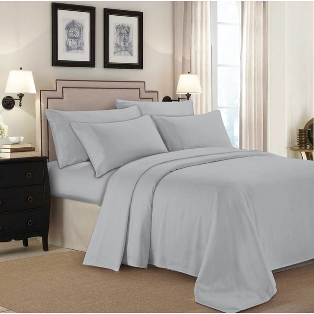 Johnson Home 500 Thread Count Certified Organic Cotton Sheet Sets in light grey on a made bed with beige upholstered headboard, featuring four pillowcases and a flat sheet in a softly lit bedroom with cream curtains and framed architectural prints, providing breathable, durable, and hypoallergenic bedding suitable for year-round comfort.