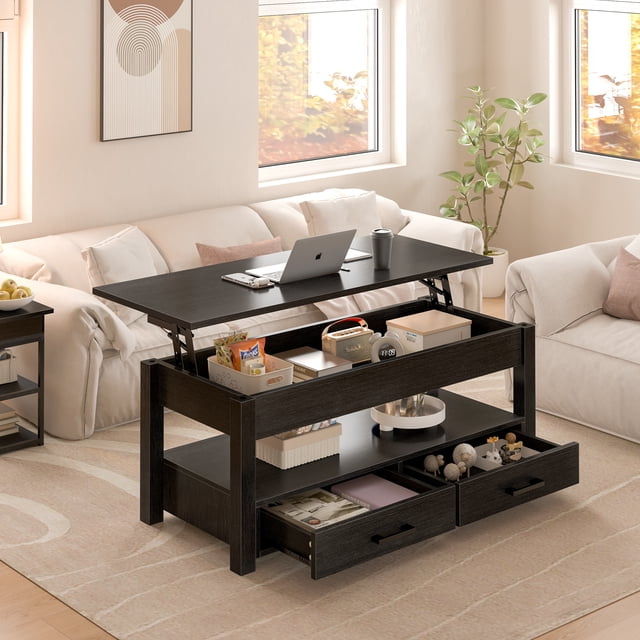 GUNAITO Table Basse à Plateau Relevable avec 2 Tiroirs, Table Centrale convertible en Bois Noire, Mesurant 42 Pouces. la Table Présente un design à Plateau Relevable pour une Hauteur Réglable, Créant un Espace de Travail Ou une surface de Salle à Manger. Elle Comprend des Compartiments Cachés et des Tiroirs Doubles pour un Grand Rangement, Idéale pour Organiser des Livres, des Collations et des Fournitures de Bureau. Fabriquée en Panneau de Particules Conforme EPE, Elle Assure la Durabilité et la Stabilité. la Table Est Exposée dans un Décor de Salon Chaleureux avec une Lumière Naturelle.