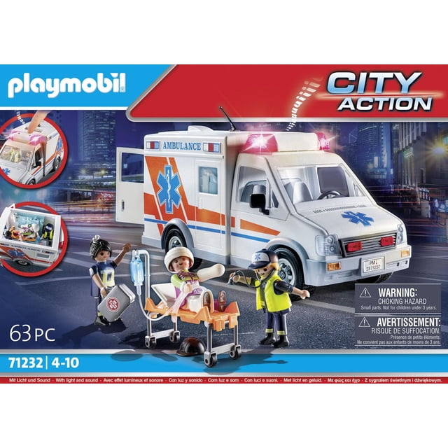 Playmobil Ambulance toy set featuring a white and orange ambulance with blue medical star decals and flashing red lights, including three figures: two paramedics and a patient on a stretcher with an IV stand, displayed on a city street at night with light and sound effects.