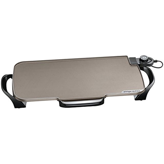 Presto 07062 Ceramic 22-inch Electric Griddle with removable handles in black. This electric griddle features a spacious ceramic nonstick cooking surface for effortless meal preparation and easy cleanup. Detachable handles allow for compact storage in 18-inch kitchen cabinets. The Control Master heat system ensures consistent temperature control, while the warp-resistant aluminum base provides durability and even heat distribution. Ideal for preparing large family meals.