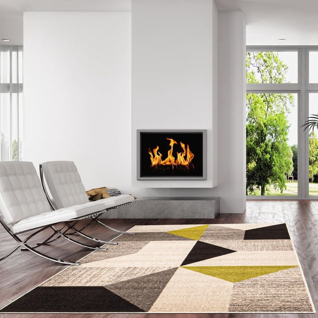 ECARPET Geometric Area Rug from the Harlow Collection featuring bold geometric patterns in beige, black, gray, and olive green, placed on dark hardwood flooring in a modern living room with white Barcelona chairs and a wall-mounted fireplace, ideal for adding softness and style to living or bedroom areas.