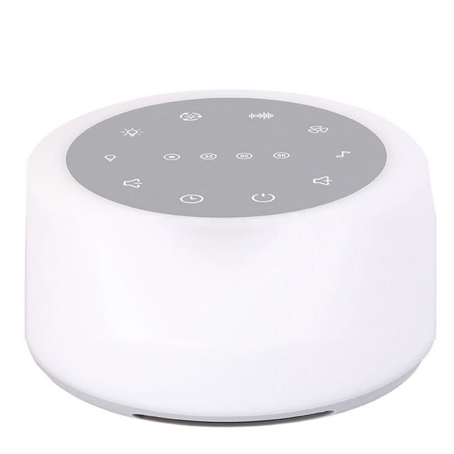 White Noise Machine, Sleep Therapy Machine, and Relaxing Light for Kids by hesignd. This compact, white plastic device features a circular design with a grey control panel on top, displaying icons for sound, light, and timer settings. It offers 24 sound options, including 7 white noise, 7 fan sounds, and 10 natural relaxing sounds. The machine includes 7-colour dazzling light, gradient light, and 5 levels of adjustable warm white light. Powered by a 1200mAh battery, it provides up to 3.5 hours of usage after a 1.5-hour charge. Comes with a USB cable.